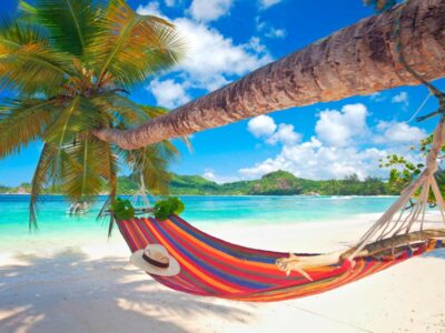 Pembury Tours - Beach Holiday - Seychelles - relax - hammock - palm trees - white sand